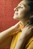 woman rubbing neck in relief - Will Your New Year’s Resolution Last?