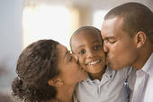 couple kissing young son - Five ThingsTo Do When Your Child Steals